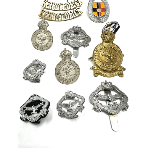 26 - collection of police badges inc kenya -northern rhodesia sarawak etc