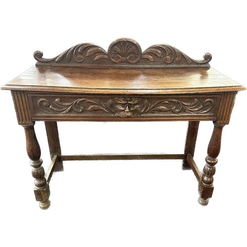 602 - Oak carved green man hall table with drawer, circa 1920's approximate measurements: Width 42 inches,... 