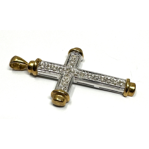 154 - 9ct white & yellow gold diamond cross 3.2 g measures approx 4.3cm by 2.4cm 0.32ct diamonds