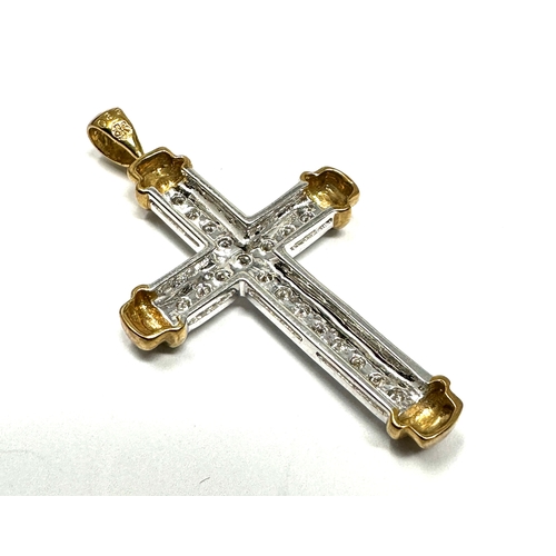 154 - 9ct white & yellow gold diamond cross 3.2 g measures approx 4.3cm by 2.4cm 0.32ct diamonds