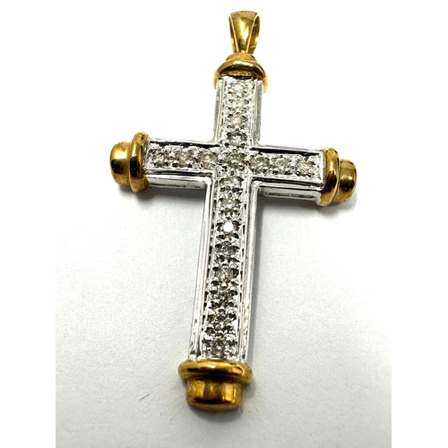 154 - 9ct white & yellow gold diamond cross 3.2 g measures approx 4.3cm by 2.4cm 0.32ct diamonds