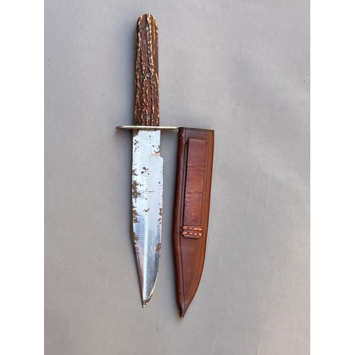 76 - Antique Bowie Knife with plain steel blade antlers grips & leather scabbard length 24cm