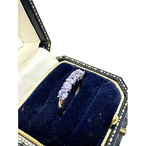 159 - 14ct white gold diamond details and tanzanite five stone ring