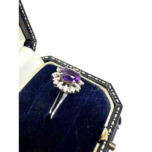 163 - 18ct white gold diamond and amethyst ring