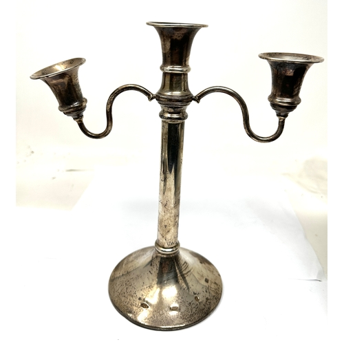 102 - Silver candelabra measures approx  height 24cm filled base