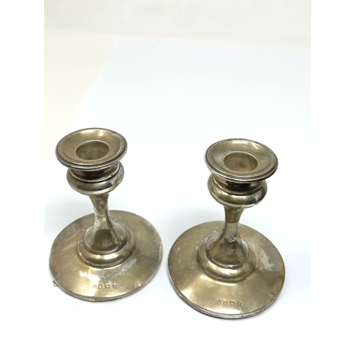 59 - Pair of silver candlesticks height 10cm