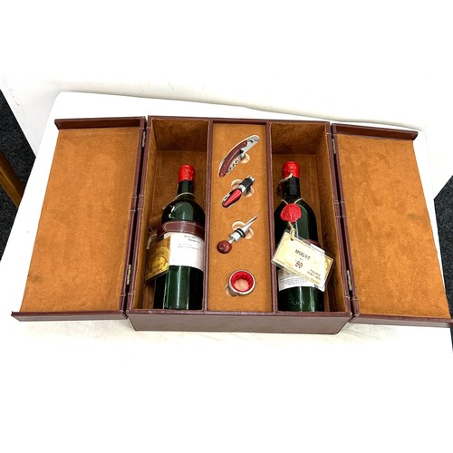 575 - Leather cased vintage Merlot wine set