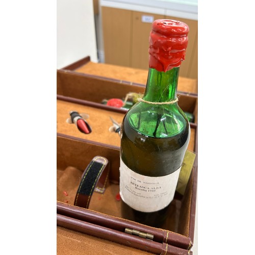 575 - Leather cased vintage Merlot wine set