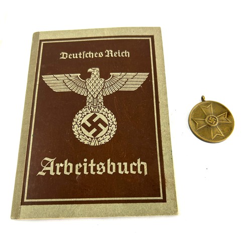 572 - WW2 Nazi German passport along with a related medal