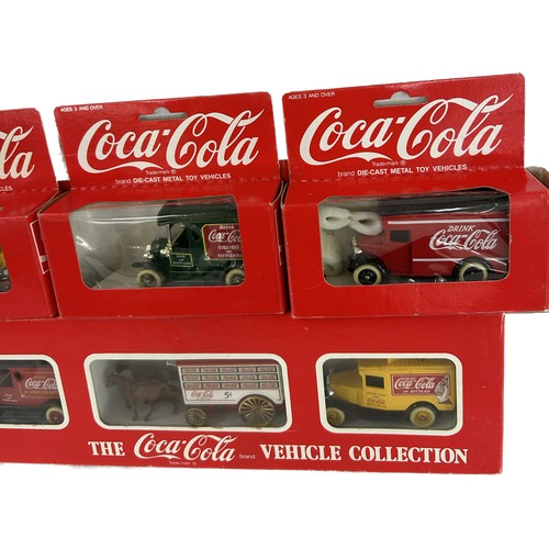 24 - Selection of boxed original Coca cola vehicles to include vehicle set, 4 individually boxed trucks