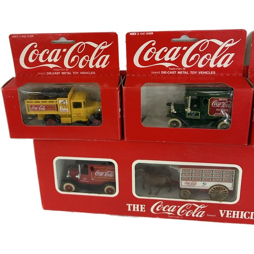 24 - Selection of boxed original Coca cola vehicles to include vehicle set, 4 individually boxed trucks