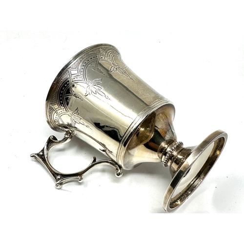 34 - Victorian silver mug measures approx 9.5cm