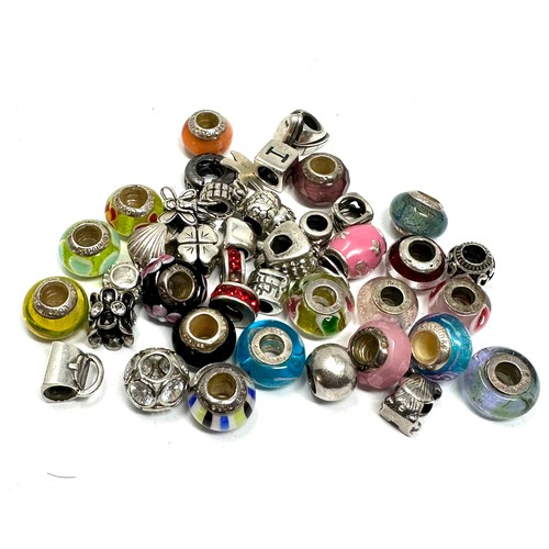 345 - 40 x .925 assorted branded charms (119g)