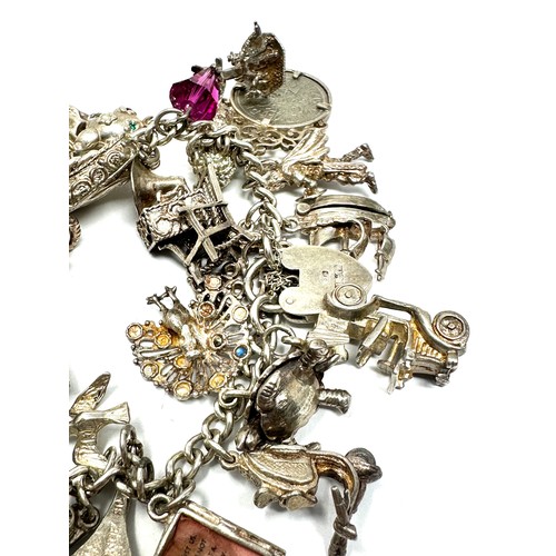 318 - .925 vintage charm bracelet with assorted charms (142g)