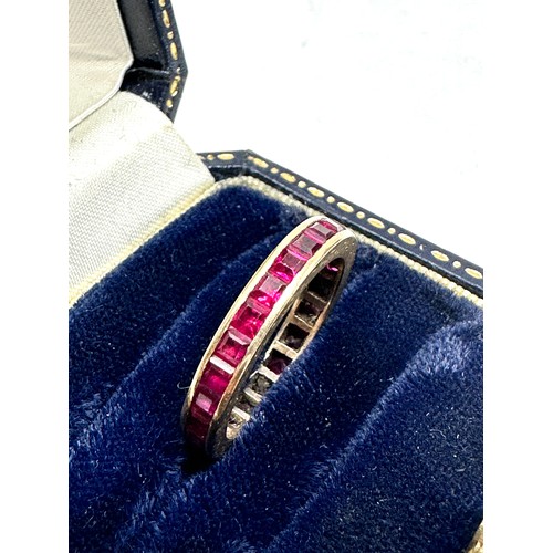 229 - 9ct gold synthetic ruby eternity ring (2.5g)