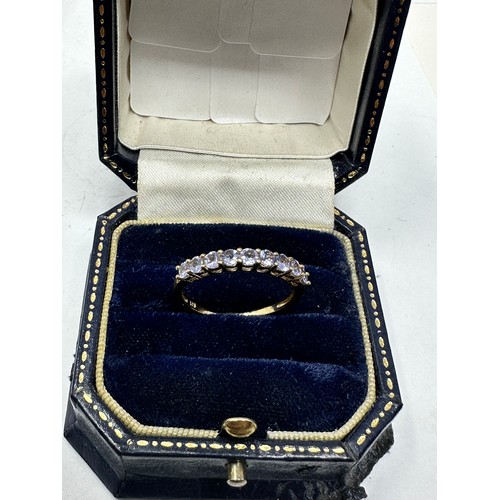 241 - 9ct gold tanzanite half eternity ring (1.4g)