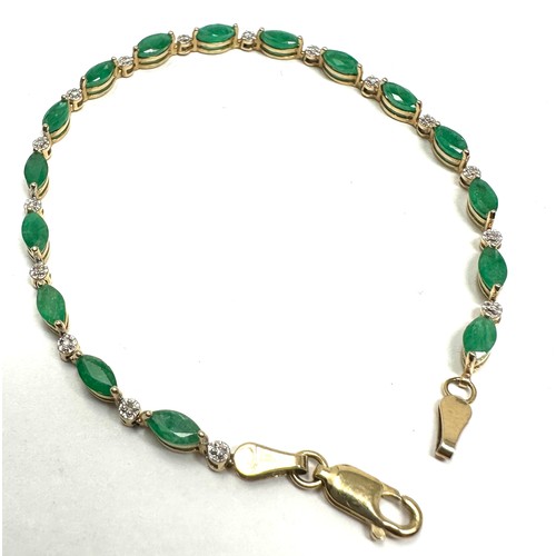 223 - 10ct gold diamond & emerald link bracelet (4.2g)