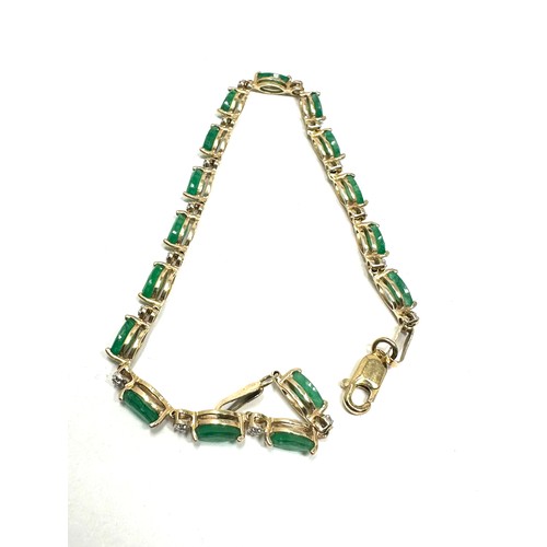 223 - 10ct gold diamond & emerald link bracelet (4.2g)