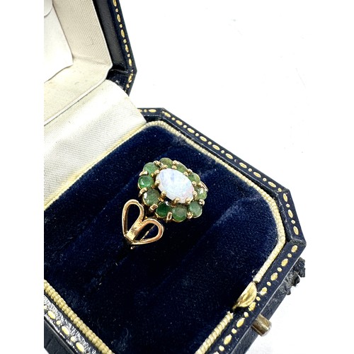 207 - 9ct gold opal & emerald oval halo ring (1.9g)