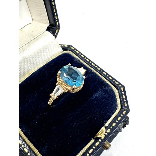 248 - 9ct gold blue & white topaz three stone ring (1.9g)