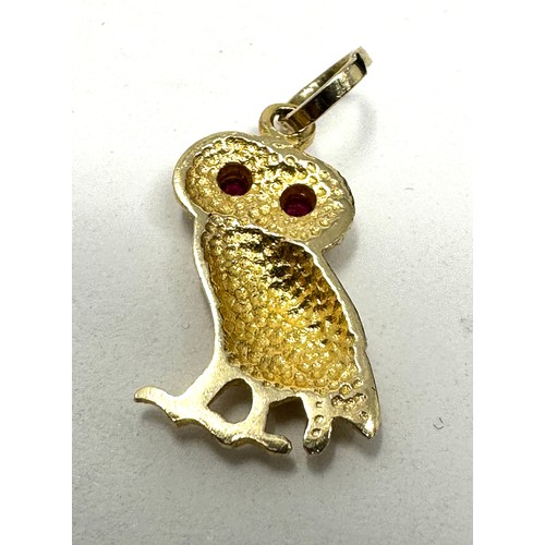 275 - 14ct gold vintage owl pendant set with ruby eyes (1.4g)