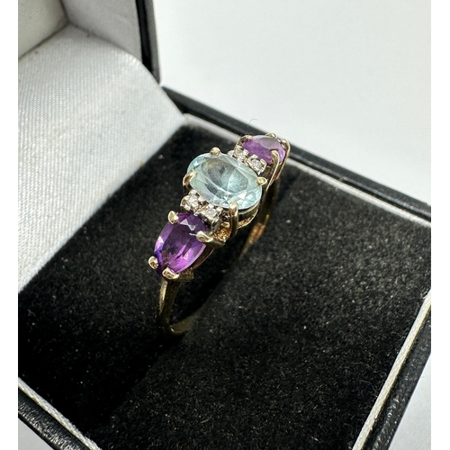 76 - 9ct gold topaz amethyst & diamond ring