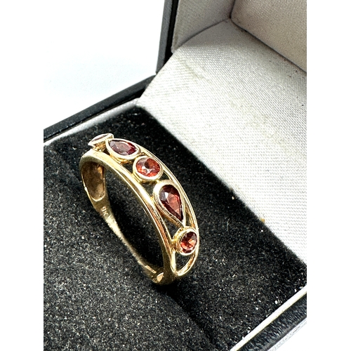 77 - 9ct gold garnet ring