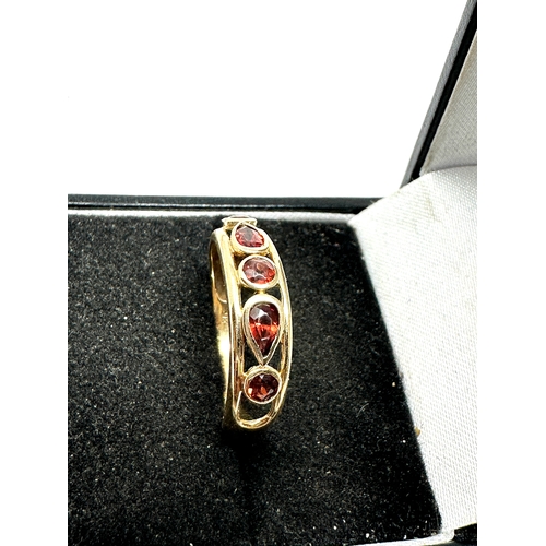 77 - 9ct gold garnet ring