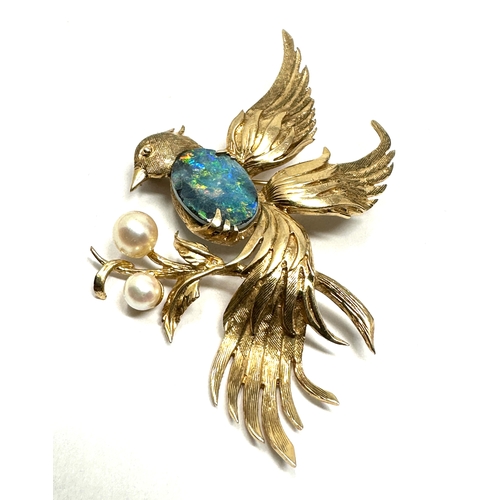 78 - 9ct gold opal doublet & pearl bird of paradise brooch measures approx 6cm by 5cm weight 9.4g