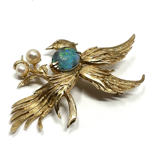 78 - 9ct gold opal doublet & pearl bird of paradise brooch measures approx 6cm by 5cm weight 9.4g