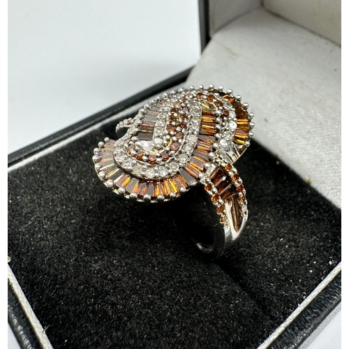 82 - 9ct white gold diamond ring set with champagne diamonds snake design ring