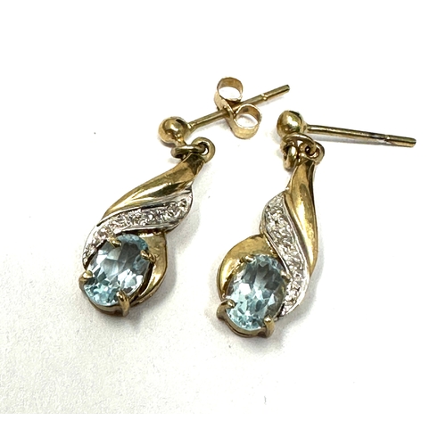 114 - 9ct gold topaz & diamond earrings