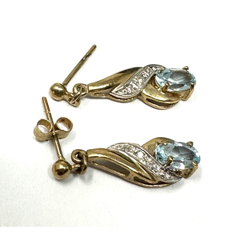 114 - 9ct gold topaz & diamond earrings