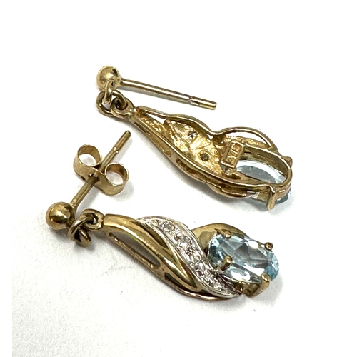 114 - 9ct gold topaz & diamond earrings