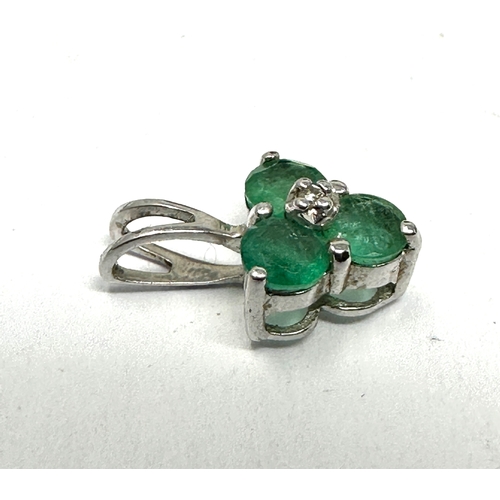 149 - 9ct white gold emerald & diamond pendant