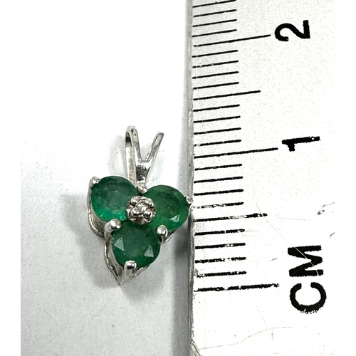 149 - 9ct white gold emerald & diamond pendant