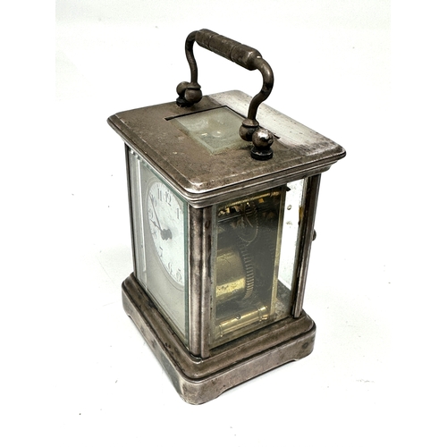 463 - Small Vintage silver plated carriage clock the clock is ticking measures approx height 8cm by 6cm wi... 