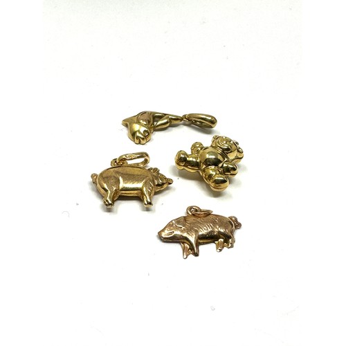 345 - 4 x 9ct gold animal pendants inc. bear, pig & fish (3.3g)