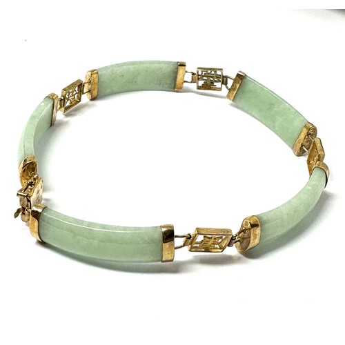 244 - 9ct gold jade link chinese bracelet (11.8g)