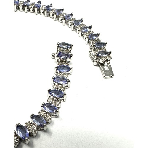 322 - 9ct white gold tanzanite & diamond bracelet  (10.8g)