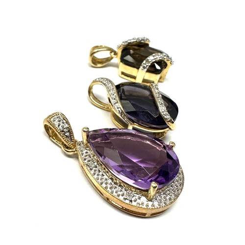 211 - 3 x 9ct gold diamond & amethyst pendants (7.3g)