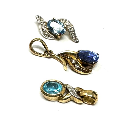 342 - 3 x 9ct gold diamond, sapphire & topaz pendants (2g)