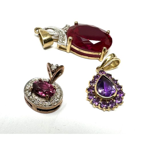 210 - 3 x 9ct gold gemstone pendants inc. diamond, synthetic ruby, amethyst & tourmaline (5.3g)