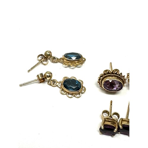 349 - 4 x 9ct gold blue topaz & amethyst earrings (4.6g)