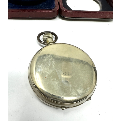 452 - gents silver travel cased goliath pocket watch the watch is ticking missing glass to watch