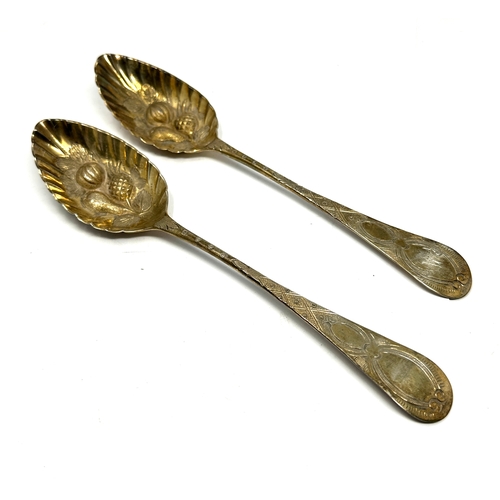 79 - 2 georgian silver berry spoons