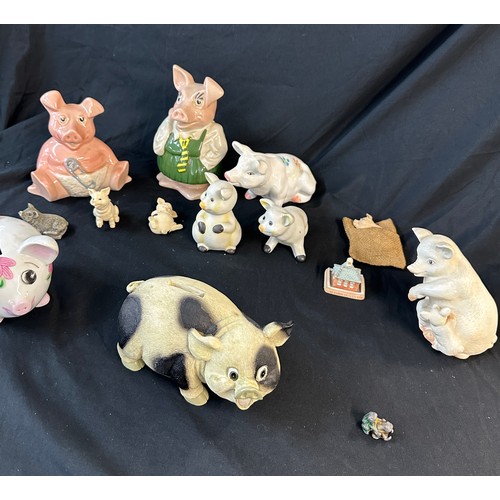 91 - Selection of collectable pigs includes money banks, small metal pig etc