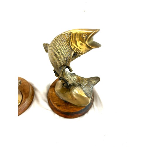 70 - Two vintage brass leaping salmon car mascots measures approx 9 inches tall