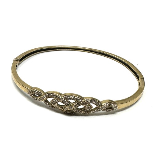 141 - 9ct gold diamond bangle (9.1g)