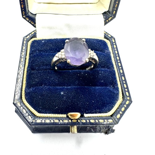 99 - 9ct white gold diamond and amethyst  ring (3.6g)